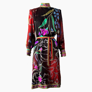 Women's long sleeve, knee length dress with abstract floral print.